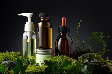 Group of skin care products with moss and leaves