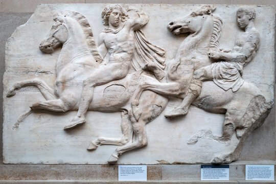 London, UK - 18 April 2022: A section of the Elgin Marbles, a collection of Greek sculptures from the Parthenon in Athens, controversially removed by Lord Elgin and now housed in the British Museum.