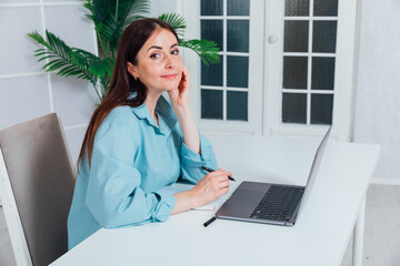 Business woman working online at computer in office