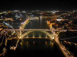 Portugal, Porto, Ponte Luis I Bridge, night aerial photo from drone