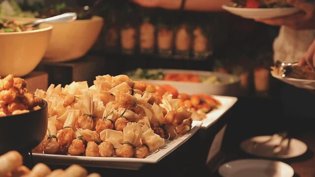 Food buffet catering lunch time seminar party with many hand of people in luxury restaurant