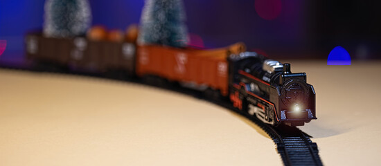 Christmas toy steam locomotive with miniature Christmas trees, Christmas decorations