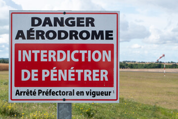 Warning sign for  active airfield and to keep out