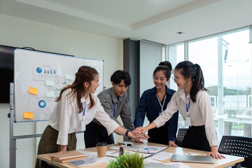 Business teamwork join hands together. business group of young people putting their hands. Teamwork...