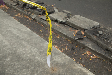Yellow caution tape on road. Construction work