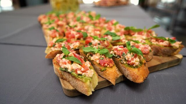 Tray with variety of Canapes: traditional snacks or appetizers for parties, events, and cocktails, served before the main meal at formal receptions.