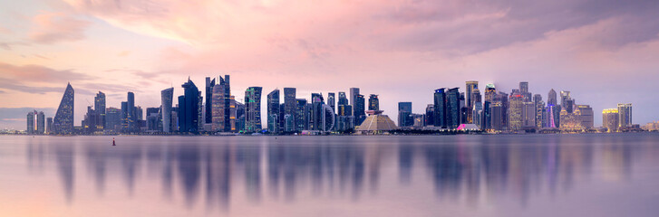 Fototapeta premium The Panoramic skyline of Doha, Qatar during sunrise