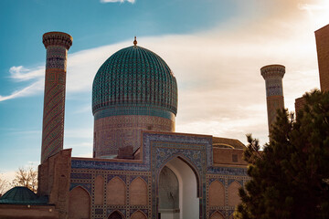 Fototapeta na wymiar beautifully falling sunlight reflecting the building of historical times, Amir Temur Mausoleum, madrasah, Samarkand, autumn.