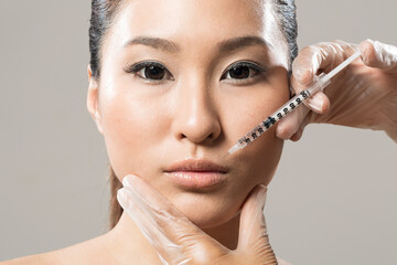 Chinese woman receiving a botox injection.