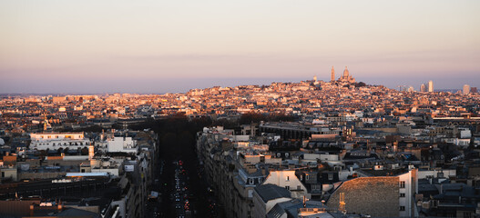 Panorama of Paris with Sacré-Cœur Basilica on sight, at sunset