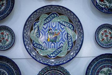 Uzbekistan, a traditional Uzbek plates in a display, handicraft items, passing from generation to generation, old crafting.