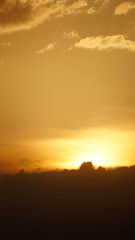 Golden clouds at sunset on a summer day