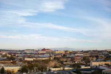 the panoramic view of the city from the mountain, beautiful mountain with the snow in the far distance