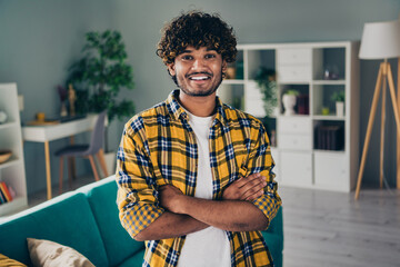 Photo of positive person folded hands toothy smile demonstrate modern house video call living room...