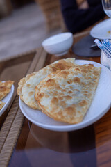 fried bread in a plate, Khiva, the Khoresm agricultural oasis, Citadel.