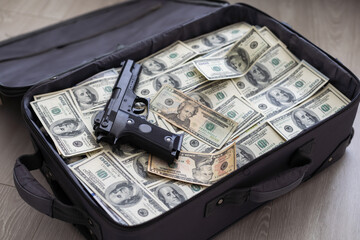 Suitcase with 100 dollar bills on grey background © Angelov
