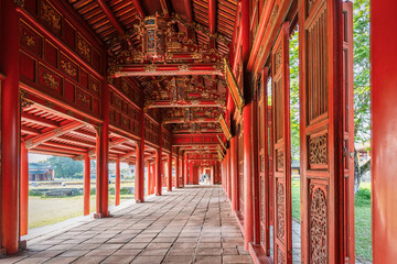 HUE,  VIETNAM , Red colored wooden porch in the imperial city of Hue. Imperial Palace of the Nguyen Dynasty in Hue.