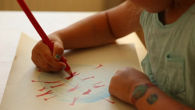 Closeup of young child drawing a picture