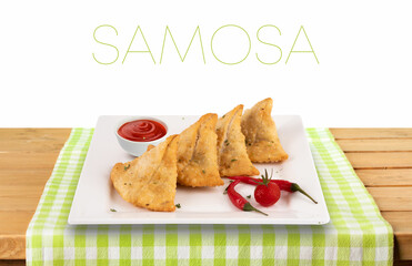 Veg Samosa - is a crispy and spicy Indian triangle shape snack that has crisp outer layer of maida filling of mashed potato, peas, and spices with Ketchup
