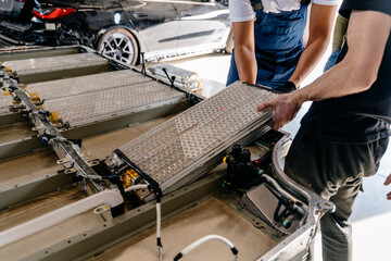 Pack of battery cells module on platform. Assembly of an electric vehicle battery after repair in...