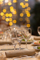 Served festive table with snacks, glasses, glasses, cutlery and napkins for a banquet