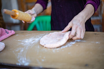 a traditional way of cooking bread in Central Asia Uzbekistan, Khiva, the Khoresm agricultural oasis, Citadel.