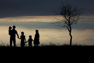 A Happy family silhouette on nature in park background