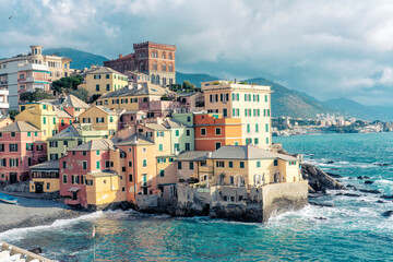 Italy, Liguria, Genoa, Pastel colored houses in Boccadasse district
