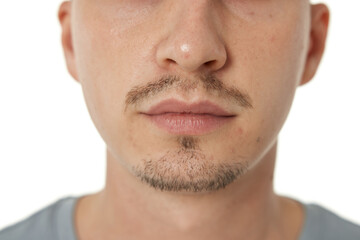 Fototapeta premium Close up of male nose on white studio background