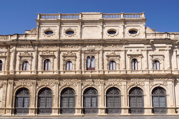 Fototapeta na wymiar Seville (Spain). Plateresque facade of the City Hall of the city of Seville in the historic center of the city