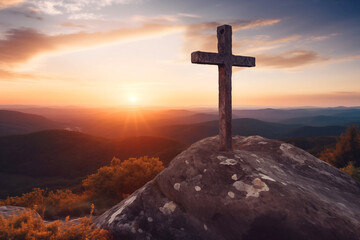 Christian cross on the mountain at sunset. A symbol of the resurrection of Jesus Christ.