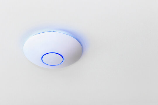 Wireless Router Network on White Ceiling. Wifi Access point. Wireless wi fi Internet Router Network Technology. Copy space. Close up.