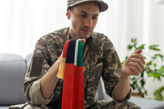 Soldier holding national flag - United Arab Emirates
