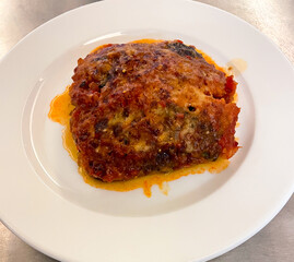 Close up view of a delicious lasagna dish in a restaurant kitchen. - 685655540