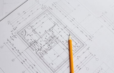 pencil and office tools for writing on the blueprint of construction industry. Place the rolls on a...