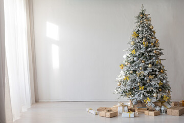 White christmas tree with gifts in interior without people
