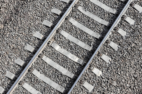 Railway background texture. Steel rails mounted on concrete sleepers