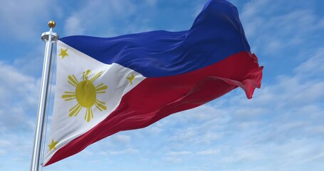 Philippines flag with flagpole waving in wind, rolling clouds background looping, 4K video (Perfect Loop)