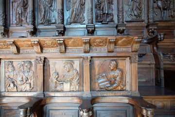 Santiago de Compostela (Galicia). Detail of the choir stalls of the Monastery of San Martín Pinario in Santiago de Compostela. - obrazy, fototapety, plakaty