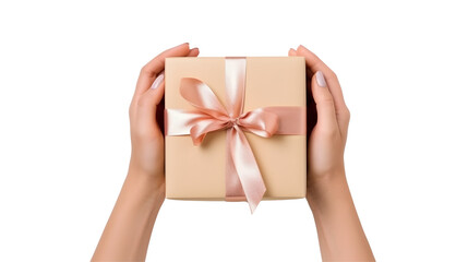 Close-up of hands holding a gift box with a pink ribbon, against a white backdrop