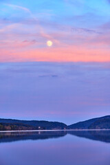 Moon over a lake in the black forest