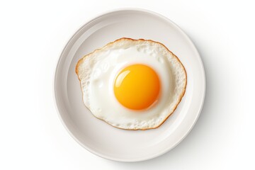 Tempting fried egg with runny yolk on white plate, isolated on clean white background - obrazy, fototapety, plakaty