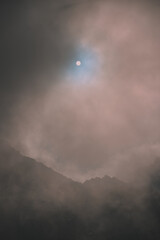 Amazing landscape in Fagaras mountains with spectacular white clouds and blue sky in Romania