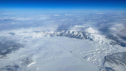 Enjoying the mountainous and snowy landscape of the U.S. state of Nevada from the window of a...