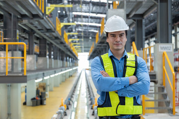 Portrait of a maintenance engineer in a railway maintenance center.