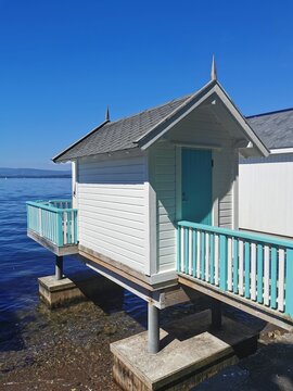Beach hut on the beach in the ocean called badehus - by the Oslo fjord in Norway