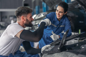 Car technician use computerized diagnostic to analyze, fix, repair engine, ensuring top performance