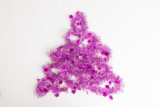 flat lay of Christmas party with purple streamers in pine tree with transparent background, top view