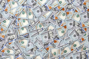 Very big amount of US hundred dollar bills close up. Huge quantity of united states currency notes on flat table
