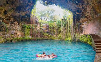 Ik-Kil Cenote - Lovely cenote in Yucatan Peninsulla with transparent waters and hanging roots. Chichen Itza, Mexico